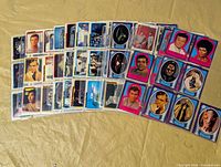 Overall view of all cards and stickers laid out in protective pages