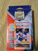 Front of sealed Hockey Gems of the Game box showing Connor McDavid example card and contents list