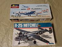 Two boxed airplane model kits: Monogram Lockheed Super-G Constellation and Airfix B-25 Mitchell