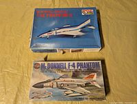 Front view of both model kit boxes