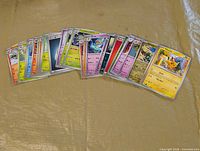 Front view showing spread of assorted Pokémon cards