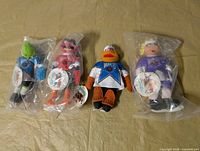 All four Muppets NHL plush dolls in original plastic bags, one open