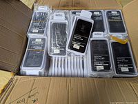 Bulk box showing numerous packaged Samsung Clear View Standing Covers