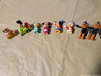 Line-up of all eight figures on table