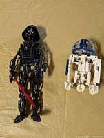 Full view of both assembled LEGO figures on surface