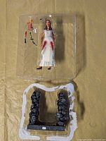 Tray containing Buffy figure, dagger, vine, statuette, chalice; base shown separately below