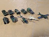 All ten vehicles and aircraft laid out on table
