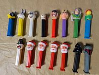 Group shot of all 16 Pez dispensers in two rows
