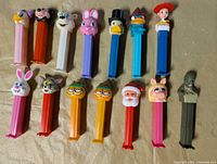 All fourteen Pez dispensers laid out in two rows