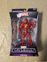 Front view of sealed Iron Man figure with Groot accessory visible
