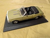 Top view of pale green 1:18 scale convertible on display base