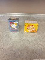 Both sealed card set boxes side by side