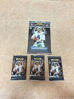 All four sealed packs laid out