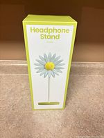 Front view of sealed box showing product render and name