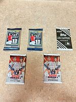 Group shot of all five sealed baseball card packs