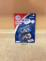 Front of sealed two-pack showing both cars and branding