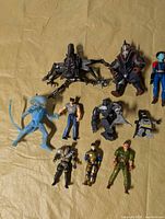 All ten action figures laid out