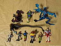 Group shot of all ten figures laid out on cloth