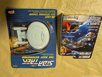 Front of both sealed packages showing Enterprise and Klingon ship boxes