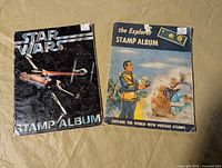 Both stamp albums front covers visible