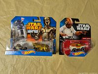 Front view of both sealed Hot Wheels Star Wars packages