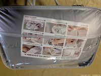 Front of sealed Urmywo baby nest carry case showing assembly instructions