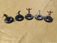 Group view of five HeroClix miniatures