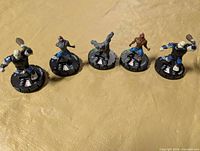 Group shot of all five HeroClix miniatures on dials