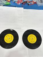 Front view showing two records with yellow Voice-O-Graph labels