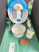 Entire lot: foot spa, electric knife, bowl, glass carafe, bud vase, snow globe, wooden box