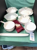 Overall lot showing casseroles, saucepan, ramekins, tray and towel