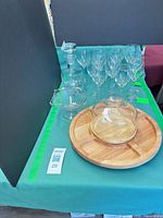 Overall lot showing decanter, wine glasses, compote, wood tray with glass dome