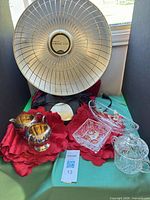 Overall lot with heater, silver pieces, crystal items, red linens