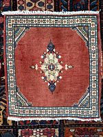 Full view of square Hamadan rug showing design and fringe