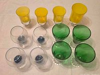 Overhead view of all 12 goblets grouped by color