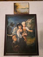 Both framed paintings together for scale reference