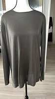 Front view of gray long-sleeve sweater tunic on mannequin