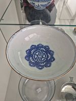 Overhead view of interior showing blue underglaze medallion, rim border and overall condition
