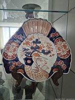 Front view of fan-shaped charger on stand showing full pattern