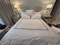 Full view of king bed showcasing duvet cover and shams