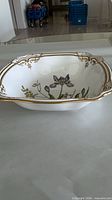 Oblique view of Spode square serving bowl showing gold-edged rim and interior floral decoration