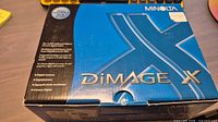 Front of blue Minolta DiMAGE X retail box