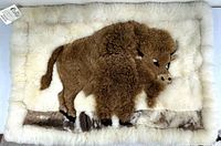 Full view of alpaca fur rug showing buffalo motif and label