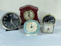 Front view of all five alarm clocks