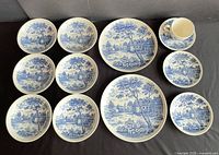 Group view of all 12 blue transferware pieces