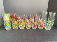 All 15 glasses lined up showing graphics and size range