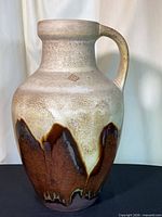 Full view of jug showing shape, handle and glaze pattern
