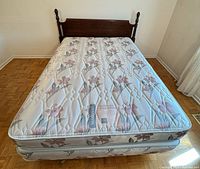Bed assembled showing headboard, mattress, box spring and frame