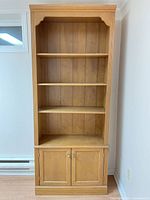 Front view showing shelves and cabinet doors