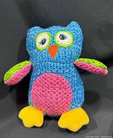 Front view showing colors, embroidered eyes, beak, wings, feet